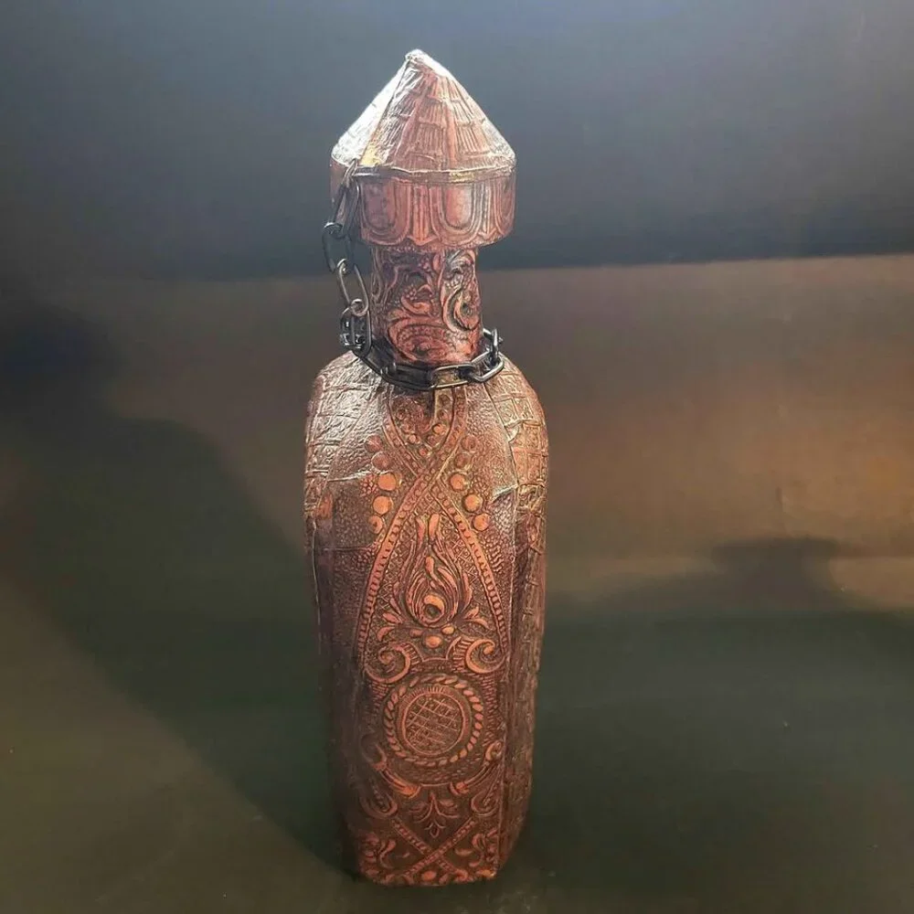 Vintage, Embossed Leather-Wrap Decanter With A Portrait Of Miguel de Cervantes